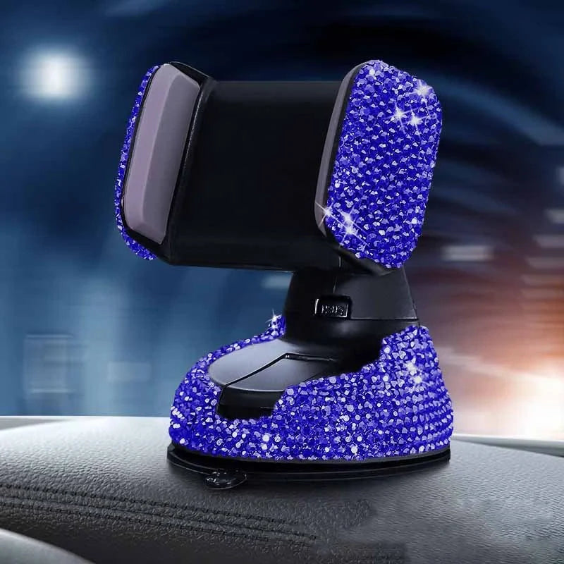 Diamond-encrusted car phone holder mounted on air vent with phone securely in place