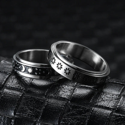 Elegant stainless steel spinner ring with a captivating moon and star design that rotates effortlessly for a calming tactile experience