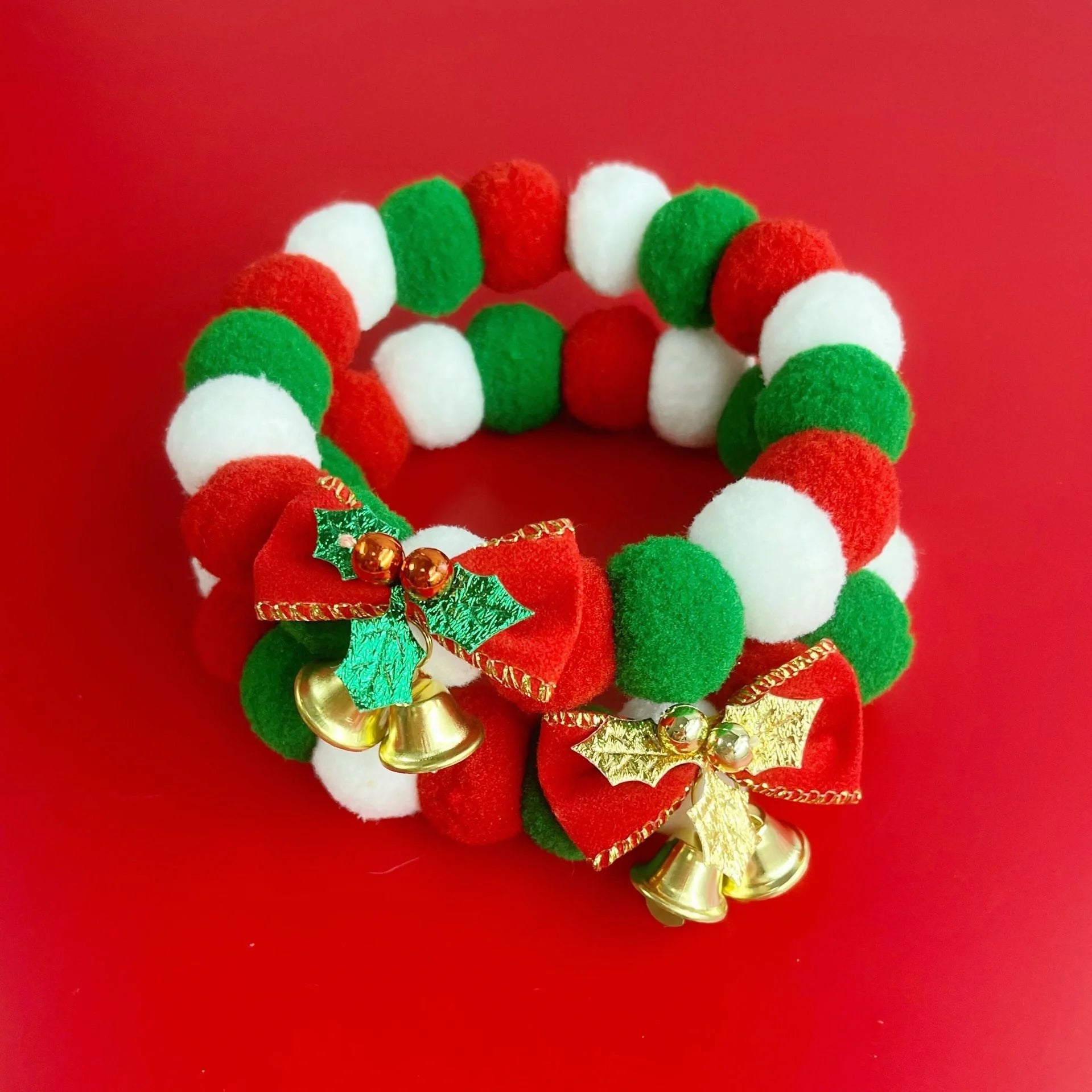 Festive plush ball pet collar with elastic fit for Christmas in green and golden leaves designs