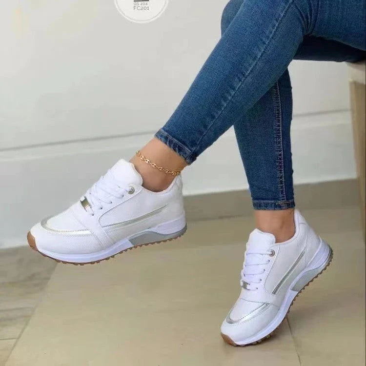 Stylish lace-up sneakers with synthetic leather upper and cushioned sole for casual comfort and versatile style.