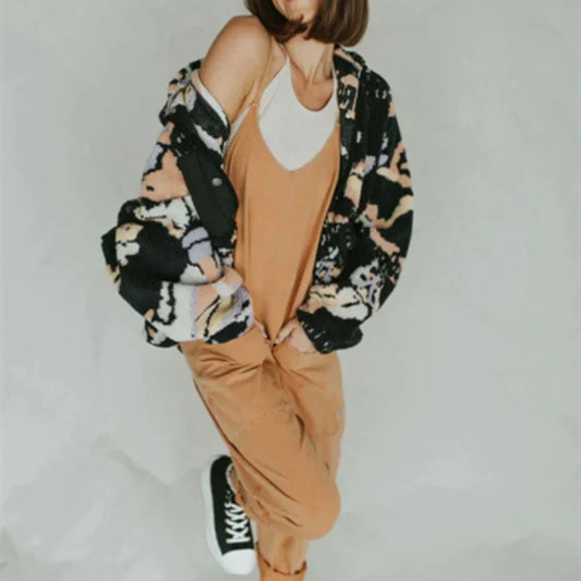 Sleeveless sling jumpsuit in various colours, showcasing versatile design and loose-fitting silhouette