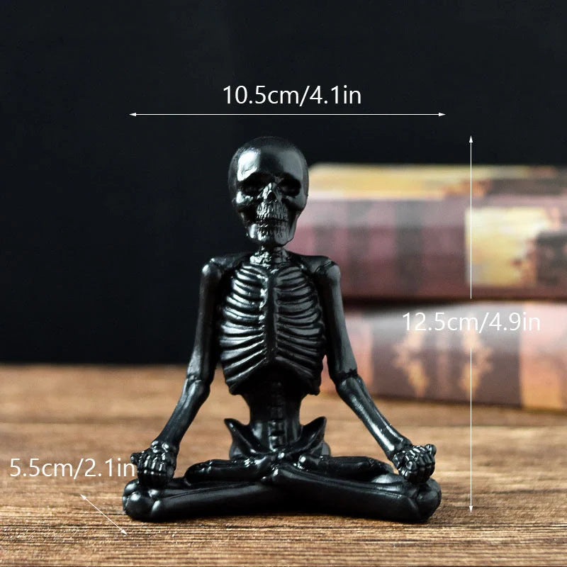 Haunting Halloween desktop ornaments, featuring intricate resin skulls and skeletons in black and vintage white finishes