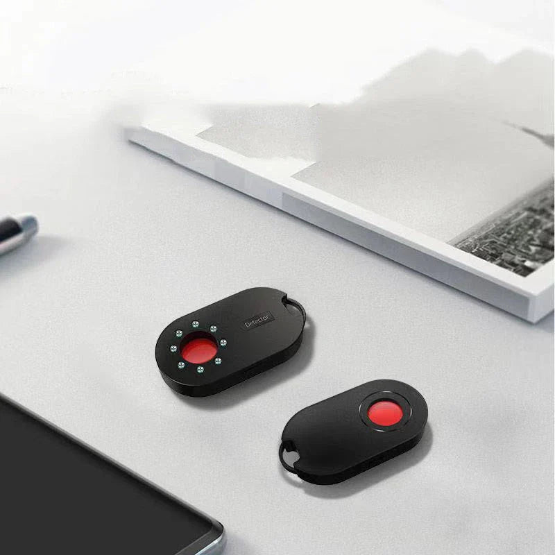 Compact, portable hidden camera detector device with infrared scanning technology to find hidden cameras in hotel rooms and other locations
