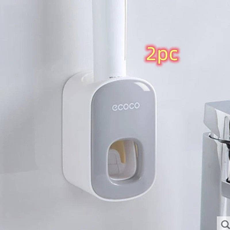 Wall-mounted automatic toothpaste dispenser with storage cups for toothbrush and bathroom accessories