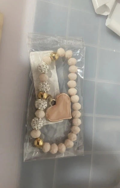 Elegant crystal heart-shaped bracelets in various vibrant colours, perfect for adding a touch of sophistication to any outfit