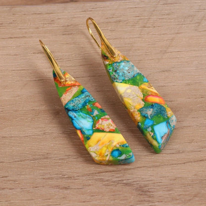 Geometric flower shape pendant earrings in copper with gold hooks, available in red, green, and blue.