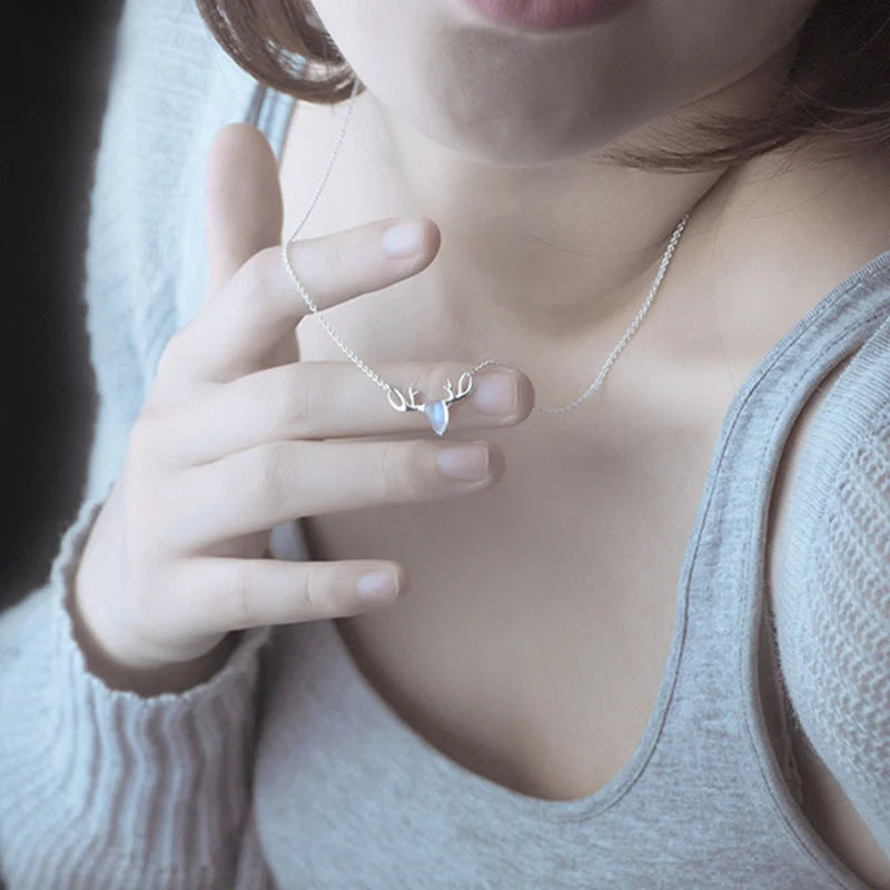 Elegant silver-toned elk necklace with a captivating moonstone pendant, a stunning Korean-inspired jewellery piece