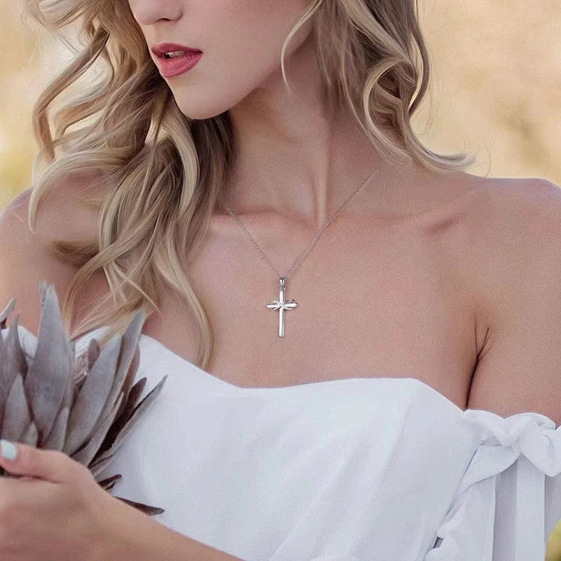 Elegant cross and infinity symbol pendant necklace in gold and silver tones, made with premium materials for a sophisticated and long-lasting accessory.