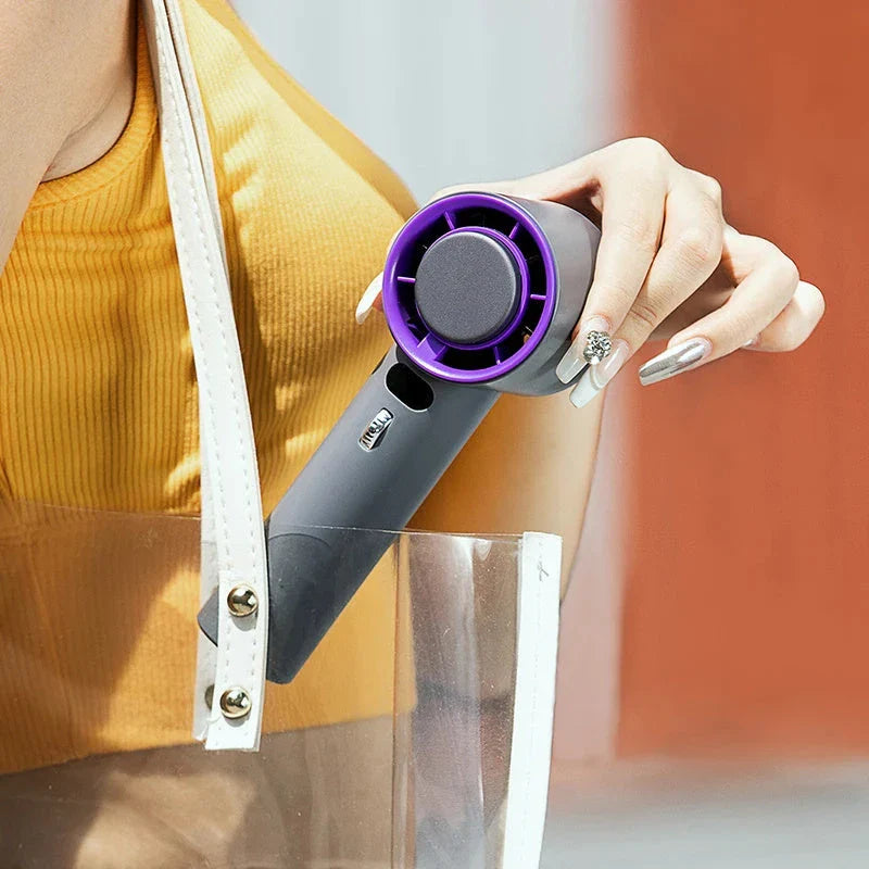 Powerful handheld cooling fan with adjustable wind speeds, long-lasting 3000mAh battery, and semiconductor refrigeration technology