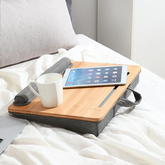 Elegant bamboo lap desk with cushioned surface and card slots for relaxing laptop use