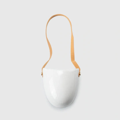 Wall-mounted ceramic flower pot in matte white with hemp rope for balcony gardening
