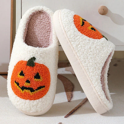 Cozy pumpkin-themed slippers with plush suede upper and non-slip rubber sole for indoor comfort