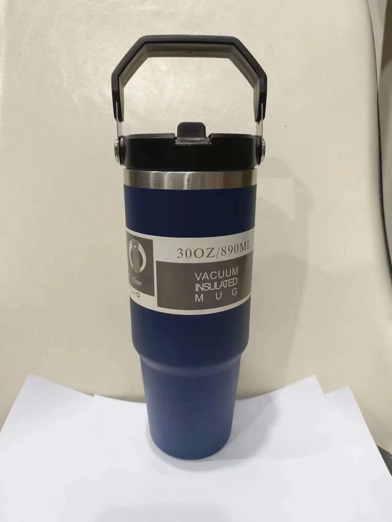 Stainless steel insulated tumbler with handle, available in multiple colors and sizes, designed to keep drinks hot or cold for hours.