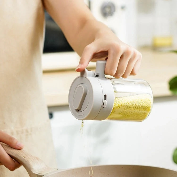 Small glass seasoning jars with lids and built-in spoons for easy measuring and storage