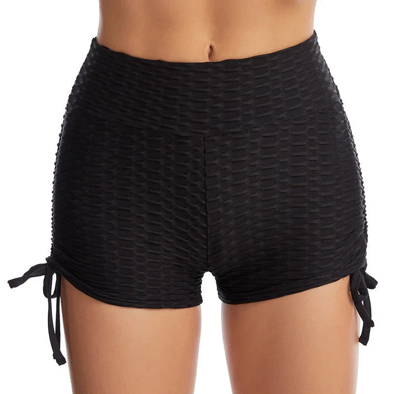 Stylish butt-lifting workout shorts with drawstring, available in various colors including pink, red, grey, navy, and black