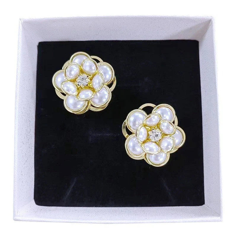 Small flower stud earrings for women in colour, black, and white options - sweet and trendy design