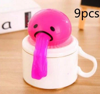 Gudetama Vomiting Egg Toy in green, orange, pink, and yellow