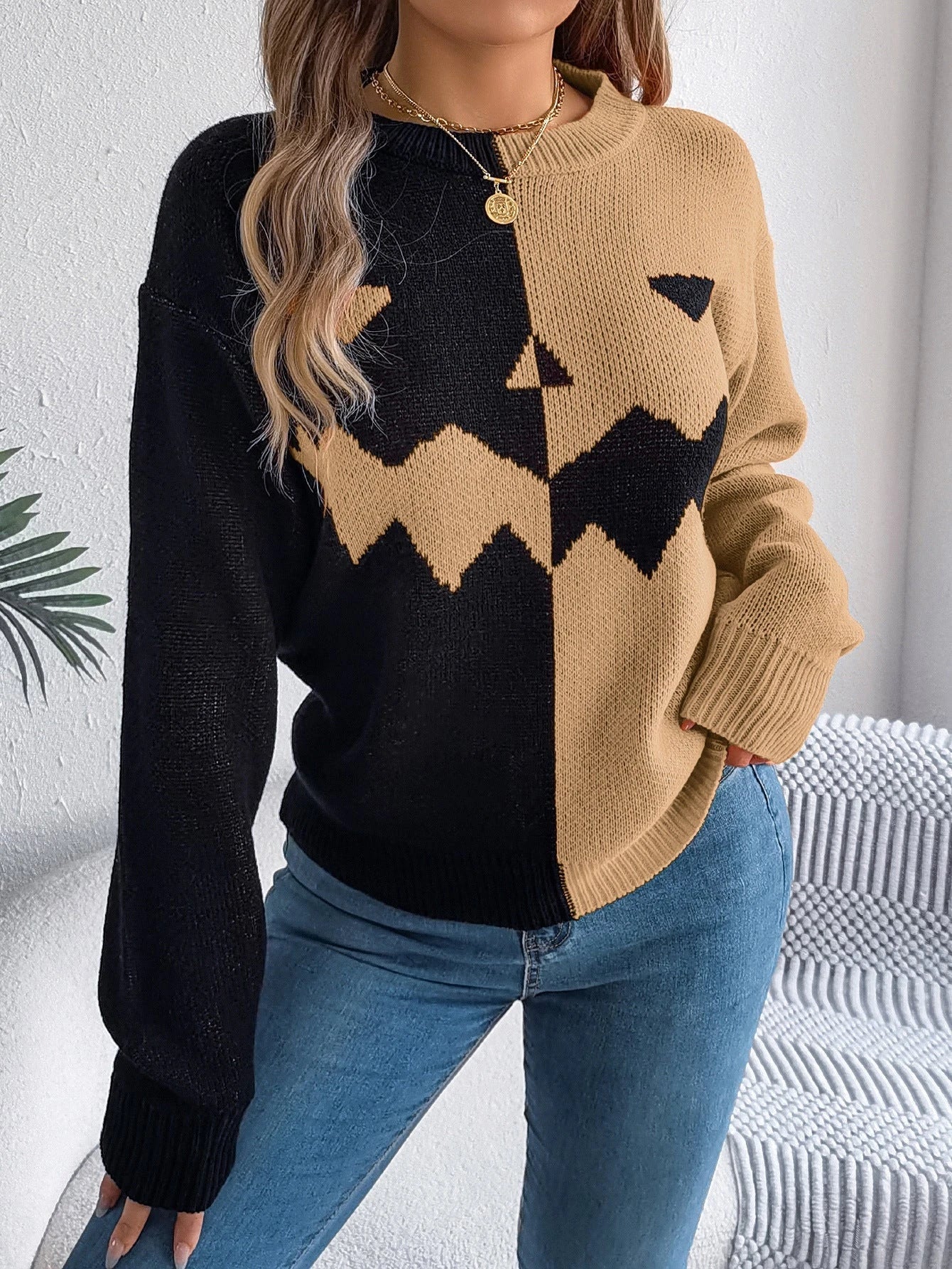A stylish Halloween pullover sweater with a ghost motif, available in a variety of vibrant colors and sizes.