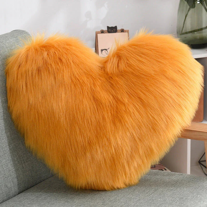 Cozy heart-shaped throw pillow with plush, shaggy texture in various colors