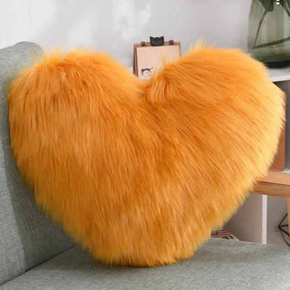 Cozy heart-shaped throw pillow with plush, shaggy texture in various colors