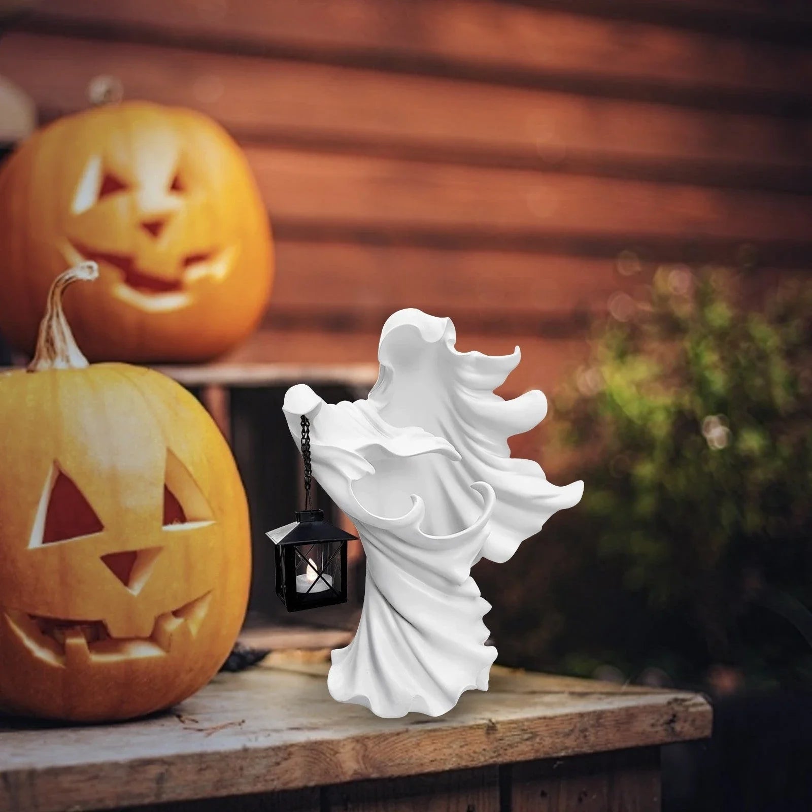 Handcrafted faceless ghost sculpture made of resin, perfect for Halloween decor and parties