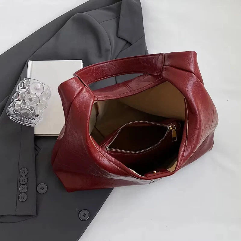 Elegant vintage designer women's shoulder bag in various colours