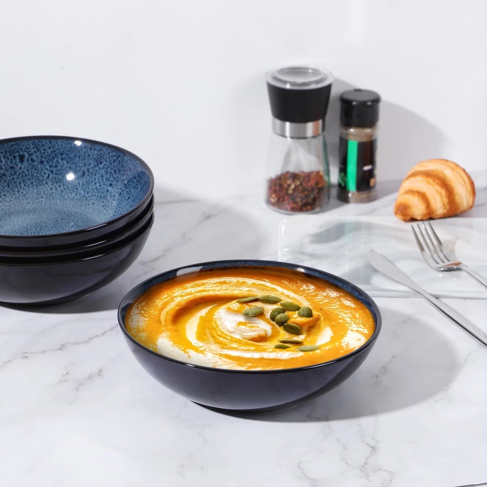 Set of four peacock green ceramic bowls with kiln change finish, 30oz capacity