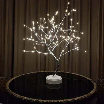 Copper-toned LED light tree with adjustable branches, providing a warm, glowing ambiance for any home decor