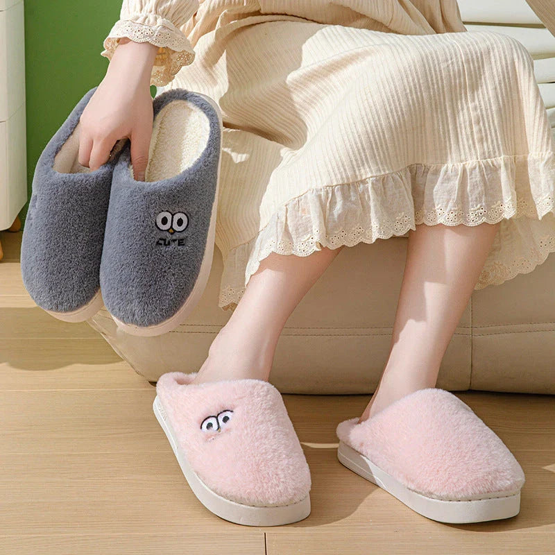 Cozy cartoon-themed slippers for couples, featuring plush material and non-slip rubber soles in a variety of vibrant colors.