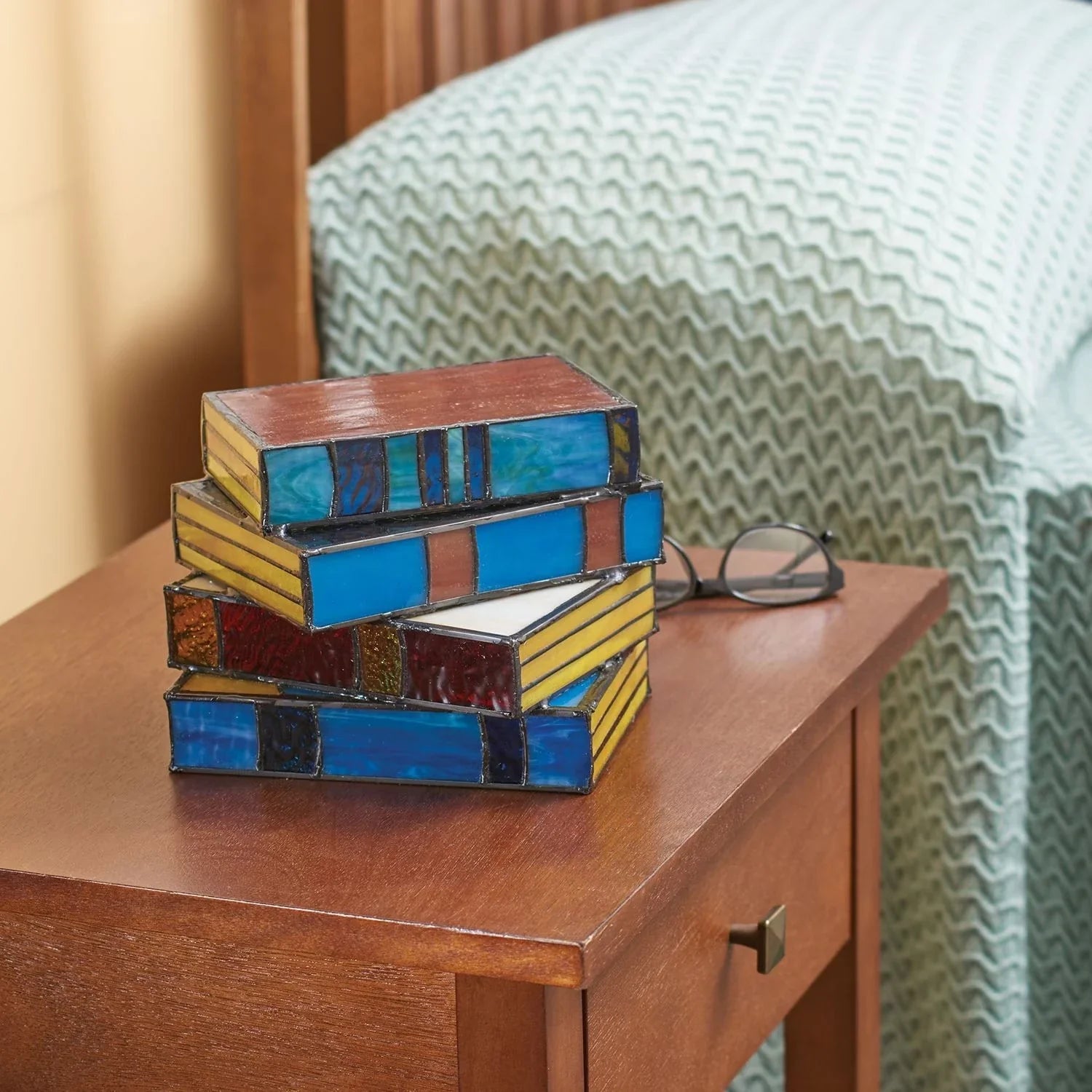 Elegant stacked book lamp with warm, ambient lighting for a cozy reading nook