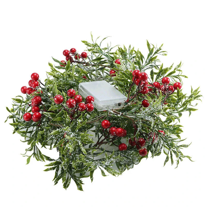 Festive Christmas lights with a decorative leaf garland, creating a cosy, enchanting display for the holiday season