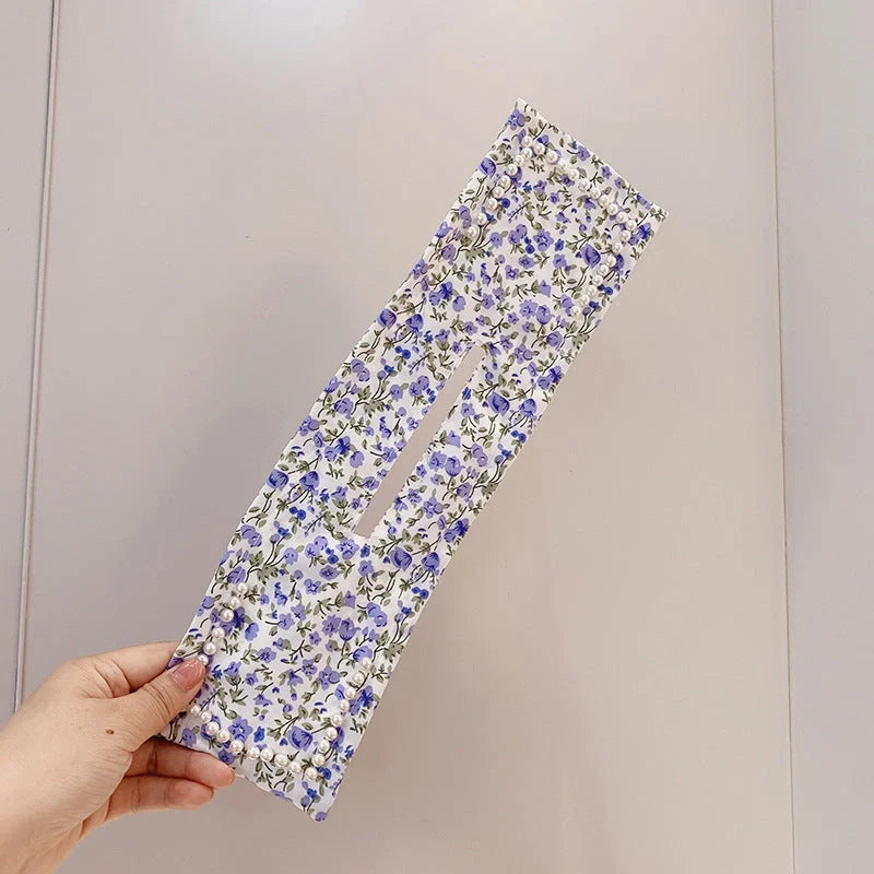 Women's elegant cloth headband with diamond and pearl accents for stylish hairstyles