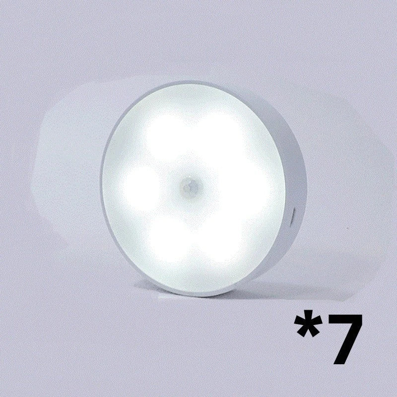 Motion-activated LED puck lights in warm and white color options, with various pack sizes and USB recharging