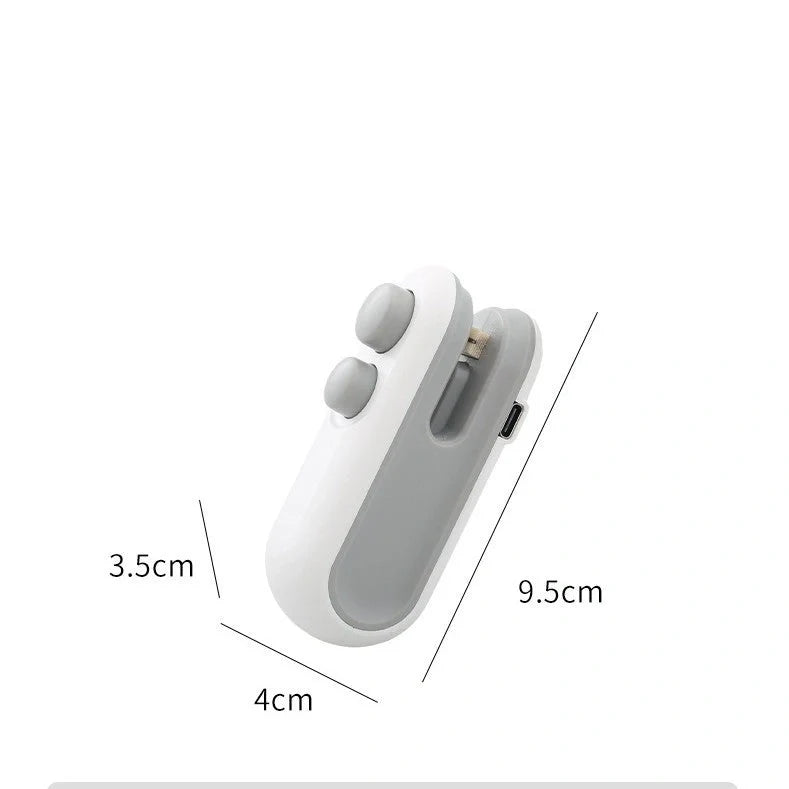 Compact USB rechargeable handheld vacuum sealer in white and blue