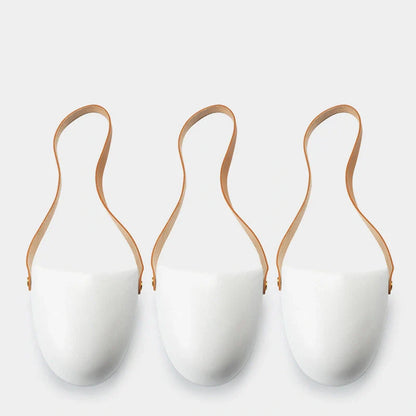 Wall-mounted ceramic flower pot in matte white with hemp rope for balcony gardening
