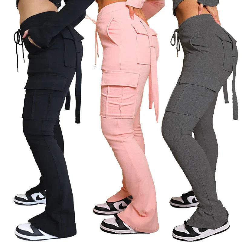 Versatile cargo trousers with pockets, high-waist design, and adjustable drawstring waistband for women