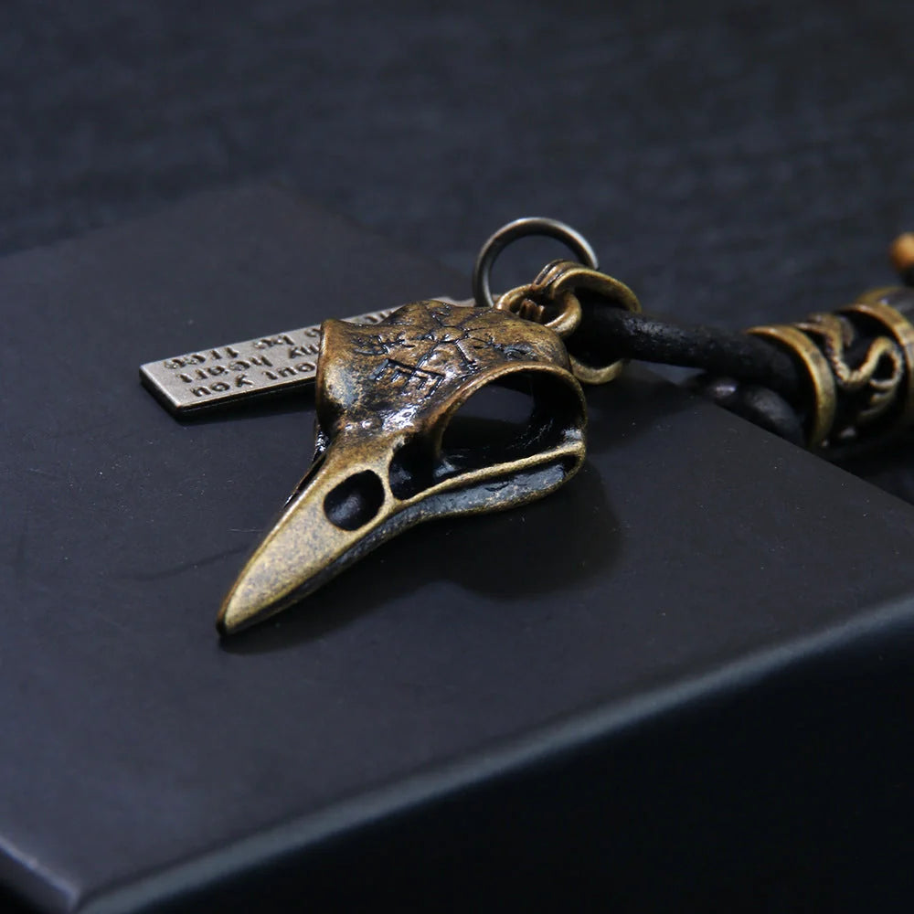 Retro leather keychain with lobster clasp and skull motif in bronze and silver