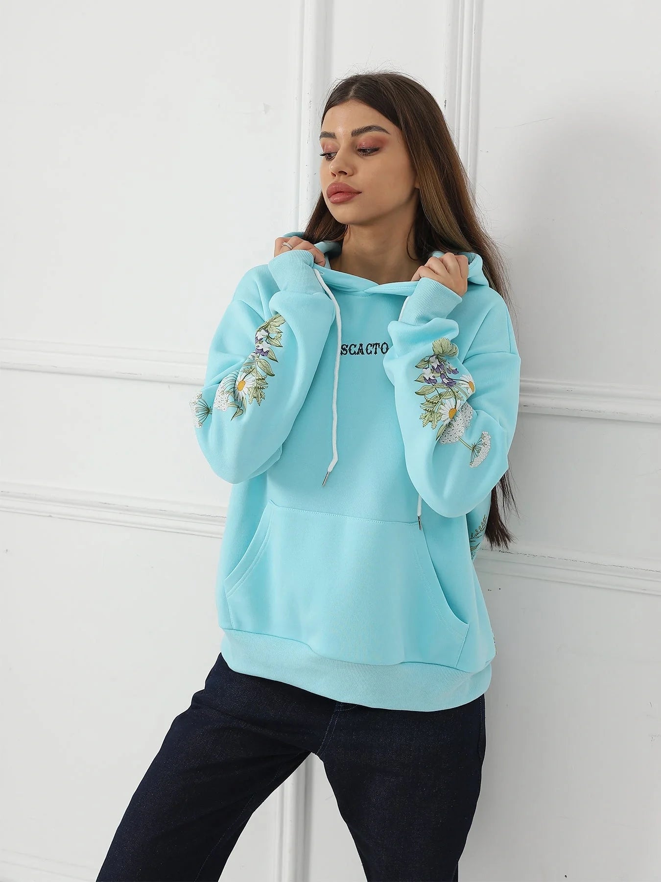Women's floral long sleeved sweatshirt in black, blue, and apricot