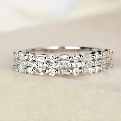 Elegant multilayer ring with a subtle geometric design, available in platinum, gold, and rose gold colours