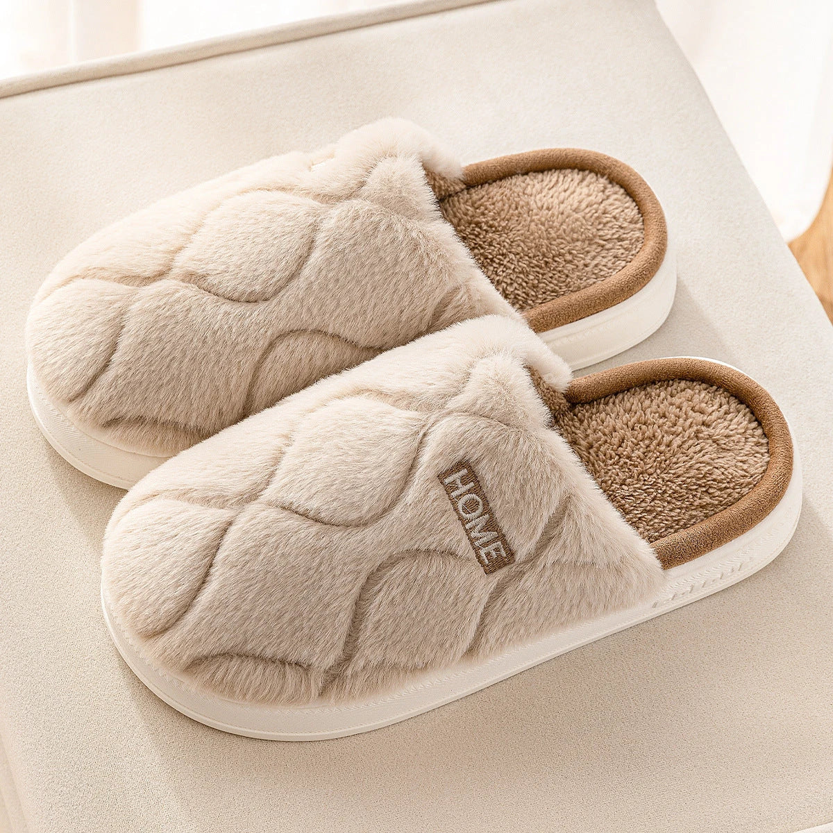 Plush slippers with soft, cushiony upper and durable PVC sole for cozy indoor comfort and traction