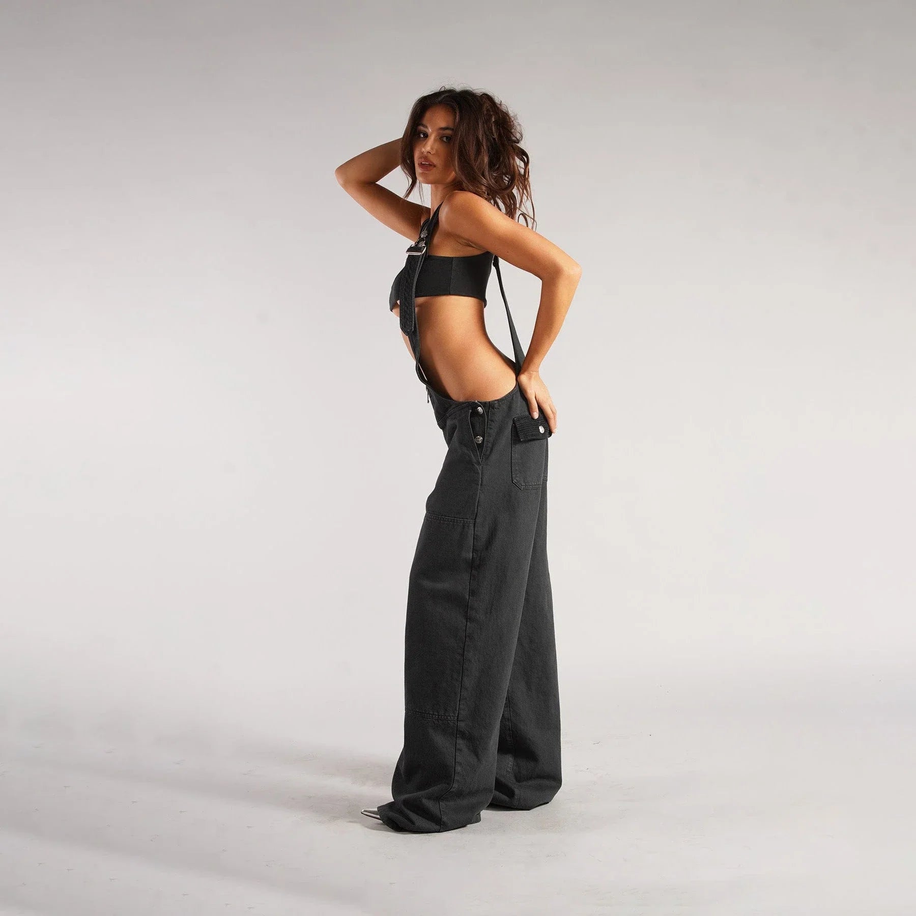 Stylish denim overalls with adjustable suspender straps, front and back pockets, and a comfortable micro-elastic fit, available in a variety of chic colors.