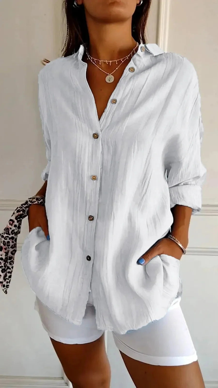 A stylish long-sleeved shirt with a pleated design, available in a variety of colours to suit any occasion.
