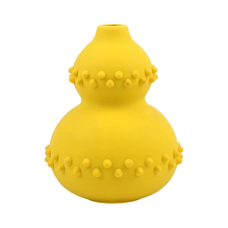 A durable, interactive dog toy made of natural rubber that dispenses treats as the dog plays with it