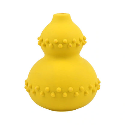 A durable, interactive dog toy made of natural rubber that dispenses treats as the dog plays with it