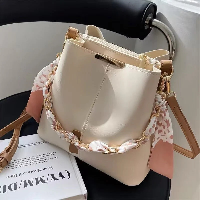 Women's PU bucket bag in white, army green, and light brown with adjustable shoulder strap
