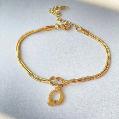 Personalised gold and silver love knot bracelets for couples, perfect as Valentine's Day gifts.