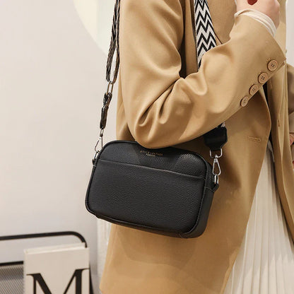 Stylish leather crossbody bag with embroidered strap in various colours