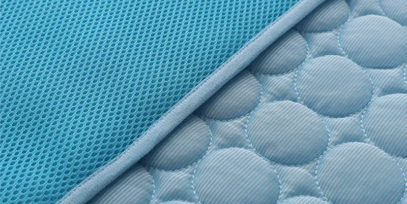 A stylish pet cooling pad featuring a blue ice silk surface and a breathable mesh backing, designed to keep pets cool and comfortable during hot summer days.