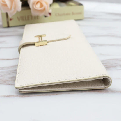 A stylish and practical long wallet made from premium leather, featuring a convenient drawstring closure to keep your essentials organised and secure.