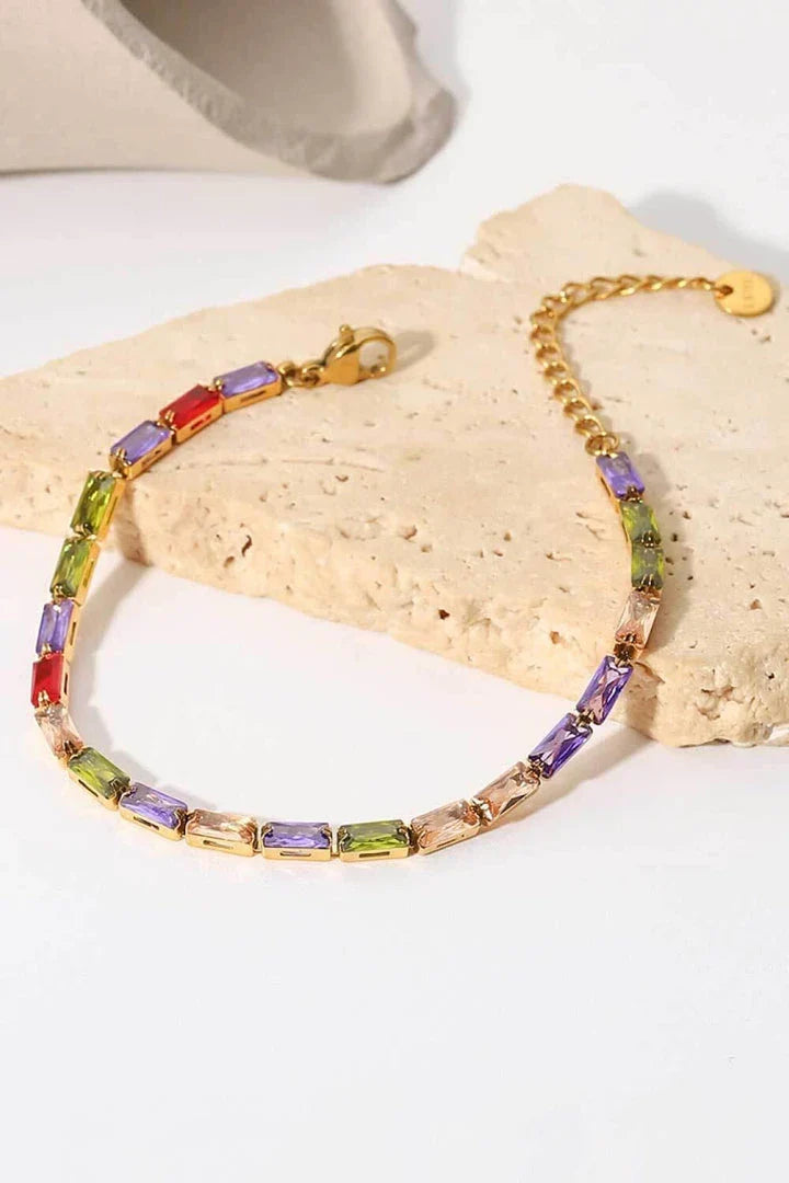 Elegant 18K gold plated bracelet with multicoloured cubic zirconia stones, a versatile accessory that adds a touch of sparkle to any outfit.